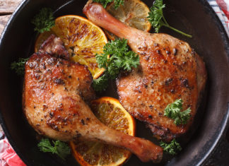 Roasted Duck Leg With Oranges In A Pan Close Up Horizontal View From Above