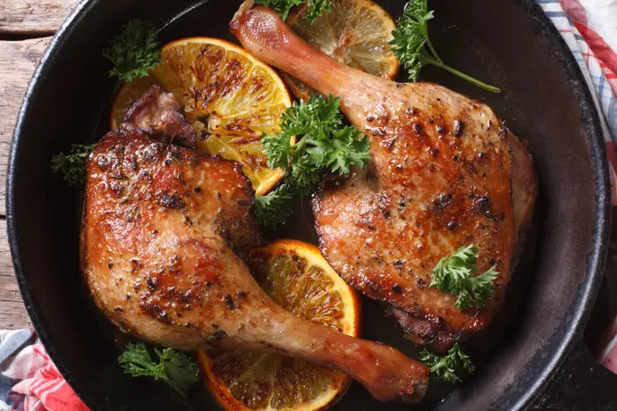 Roasted Duck Leg With Oranges In A Pan Close Up Horizontal View From Above