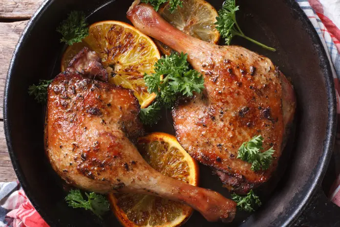 Roasted Duck Leg With Oranges In A Pan Close Up Horizontal View From Above